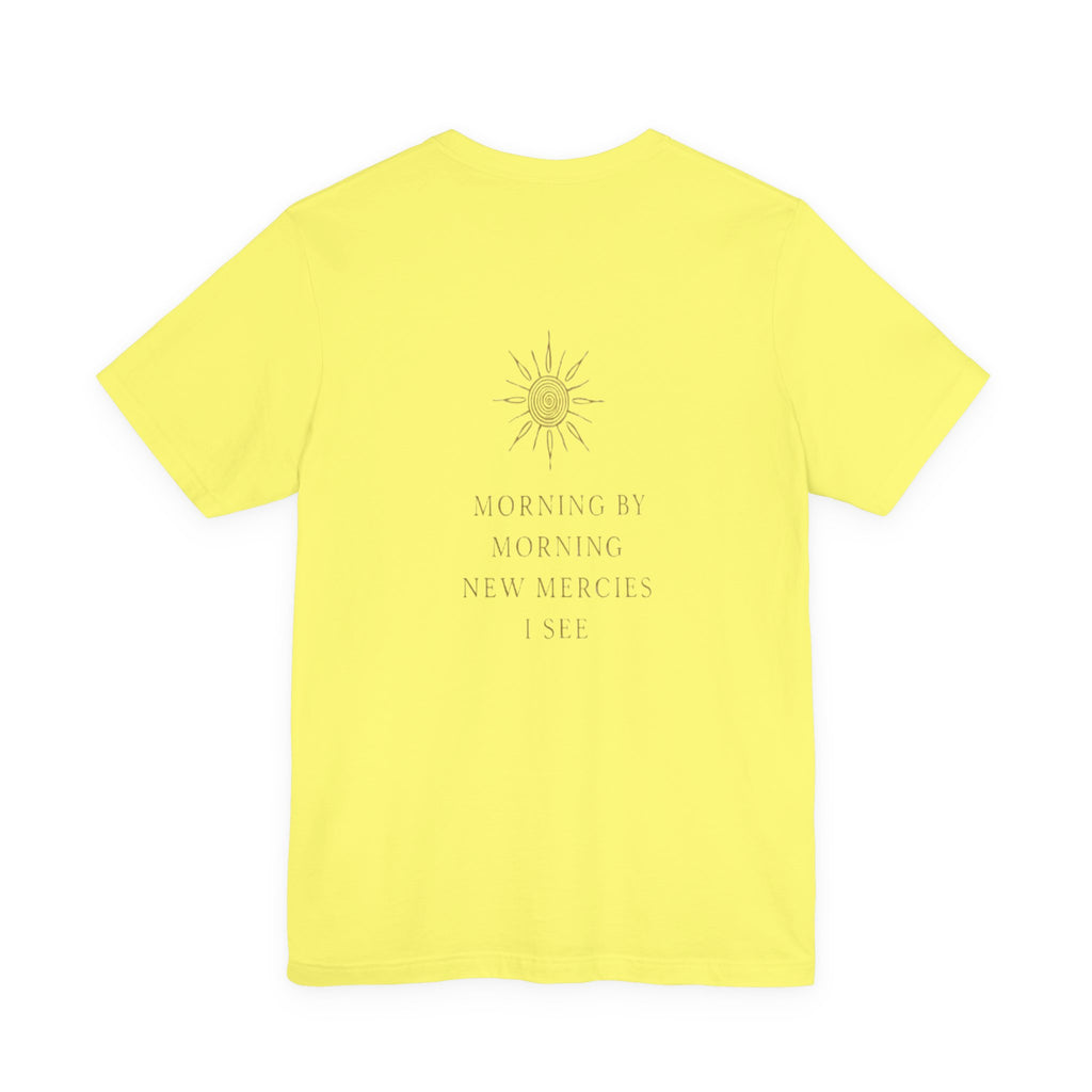 Yellow t-shirt with a sun design and text on the back against a white background