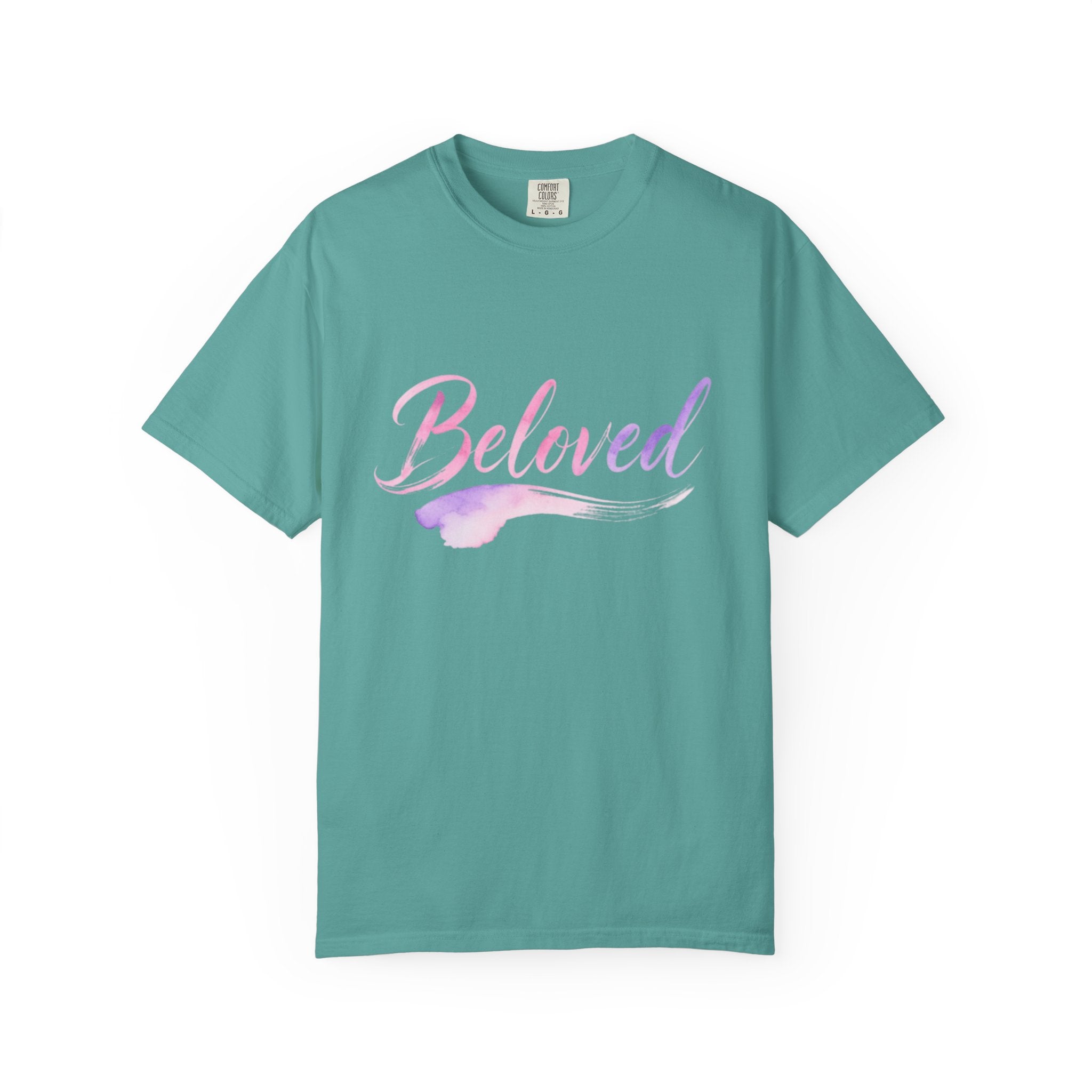 Teal t-shirt with 'Beloved' text in pink and purple on a white background