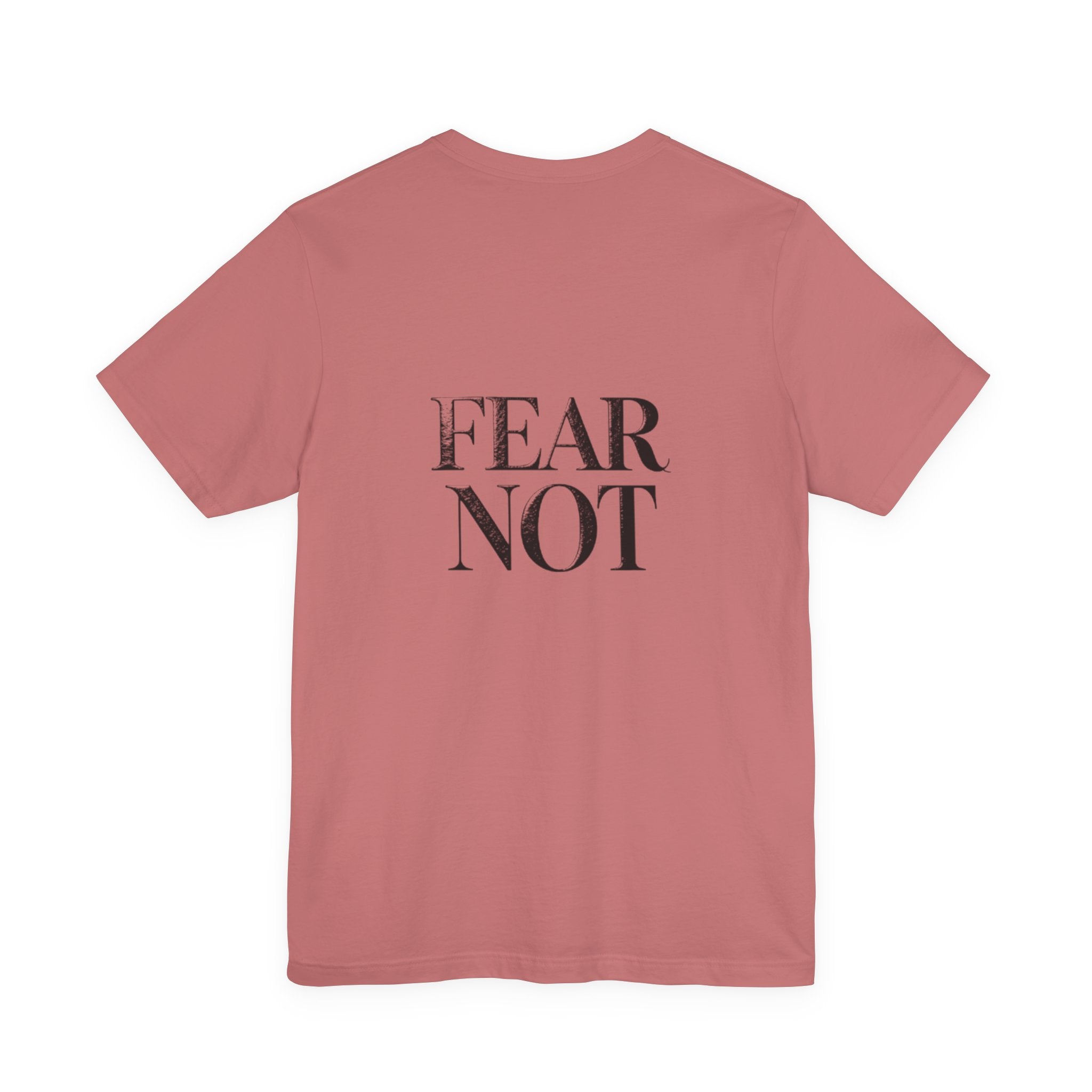 Pink t-shirt with 'FEAR NOT' text on the back against a white background