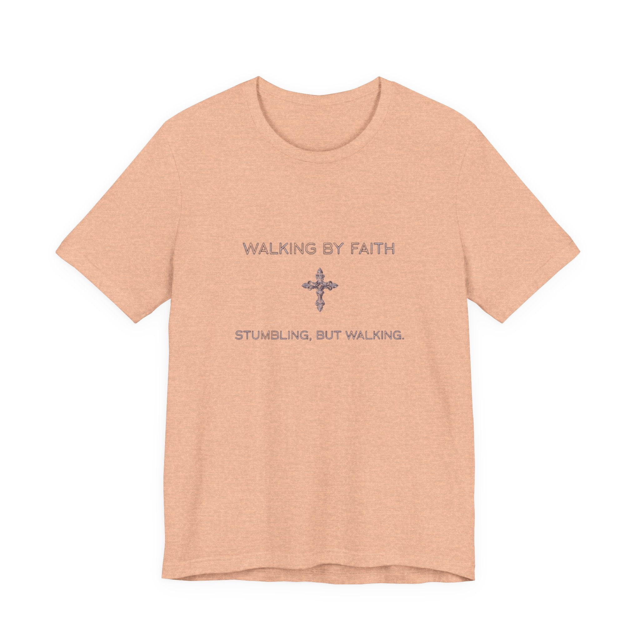 Peach t-shirt with text 'Walking by Faith, Stumbling, but Walking' on a white background