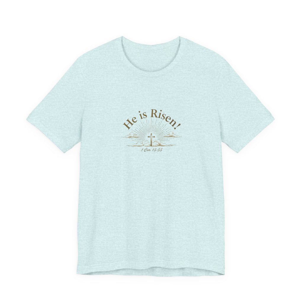 Light blue t-shirt with 'He is Risen!' text and cross design on a white background