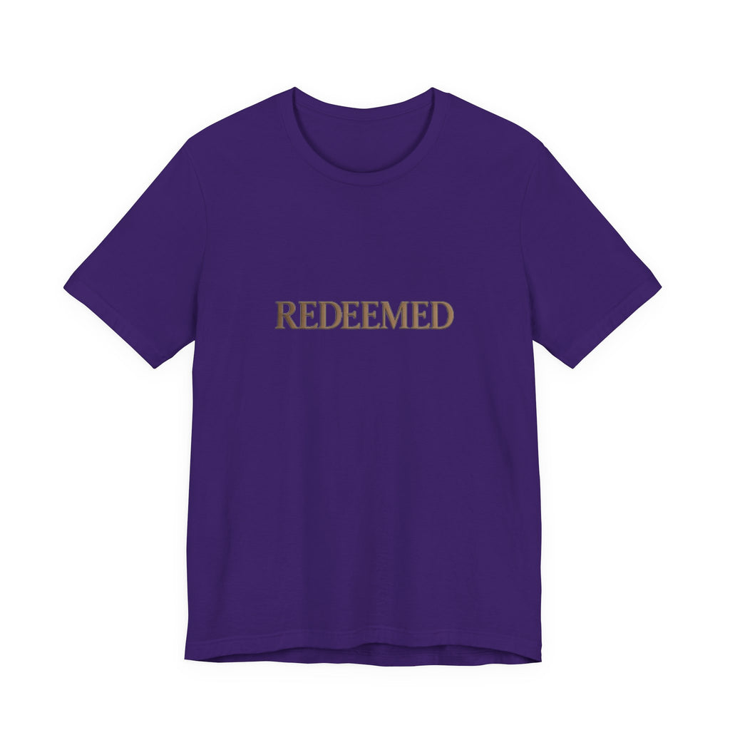 Purple t-shirt with 'REDEEMED' text on a white background