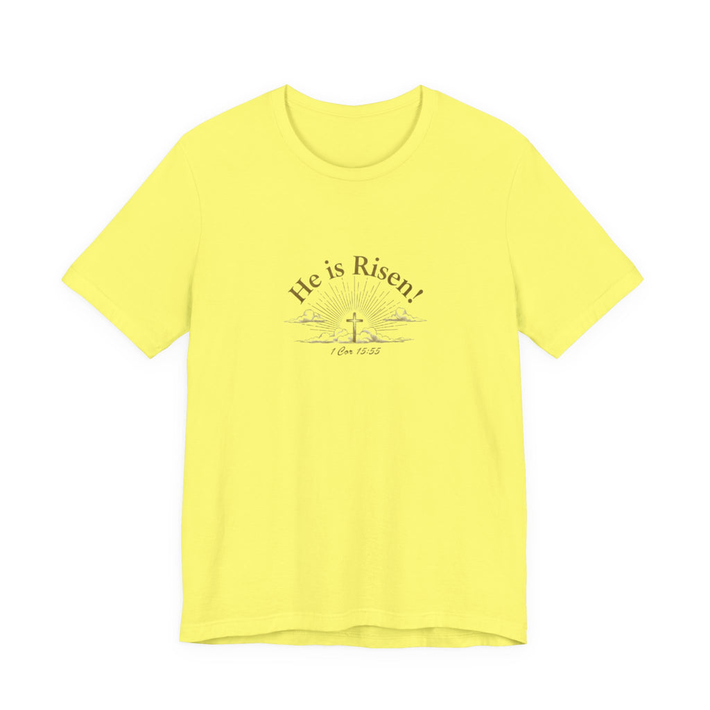 Yellow t-shirt with 'He is Risen!' text and cross graphic on a white background