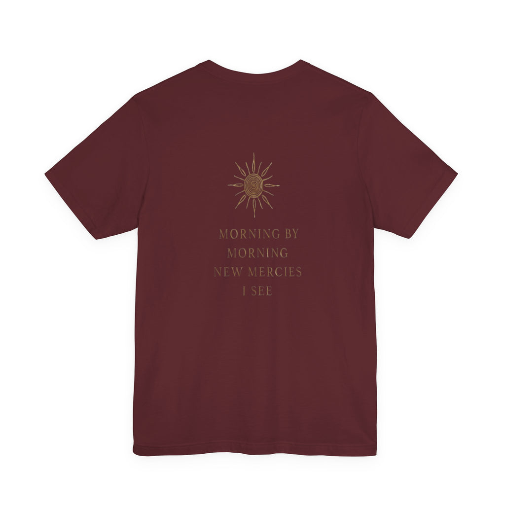 Maroon t-shirt with a sun design and text on the back against a white background