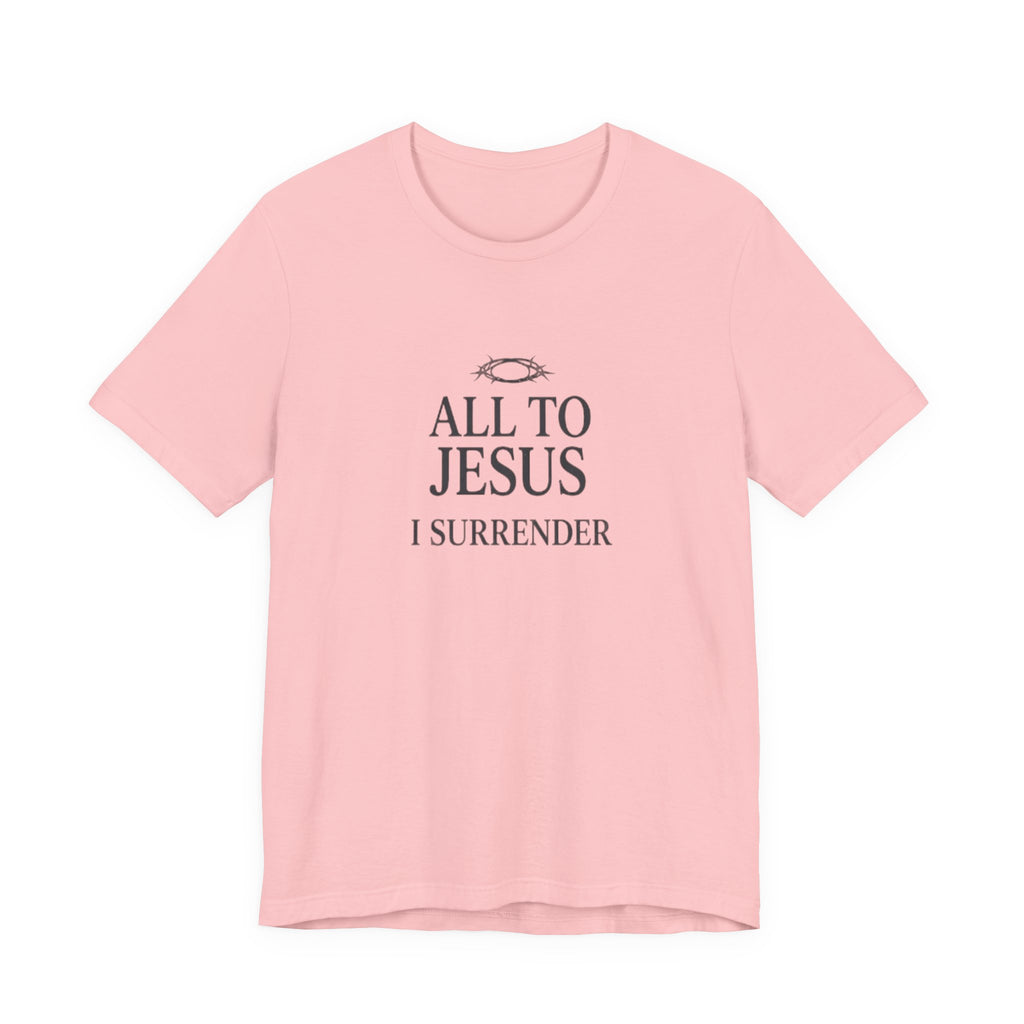 Pink t-shirt with 'All to Jesus I Surrender' text on a white background