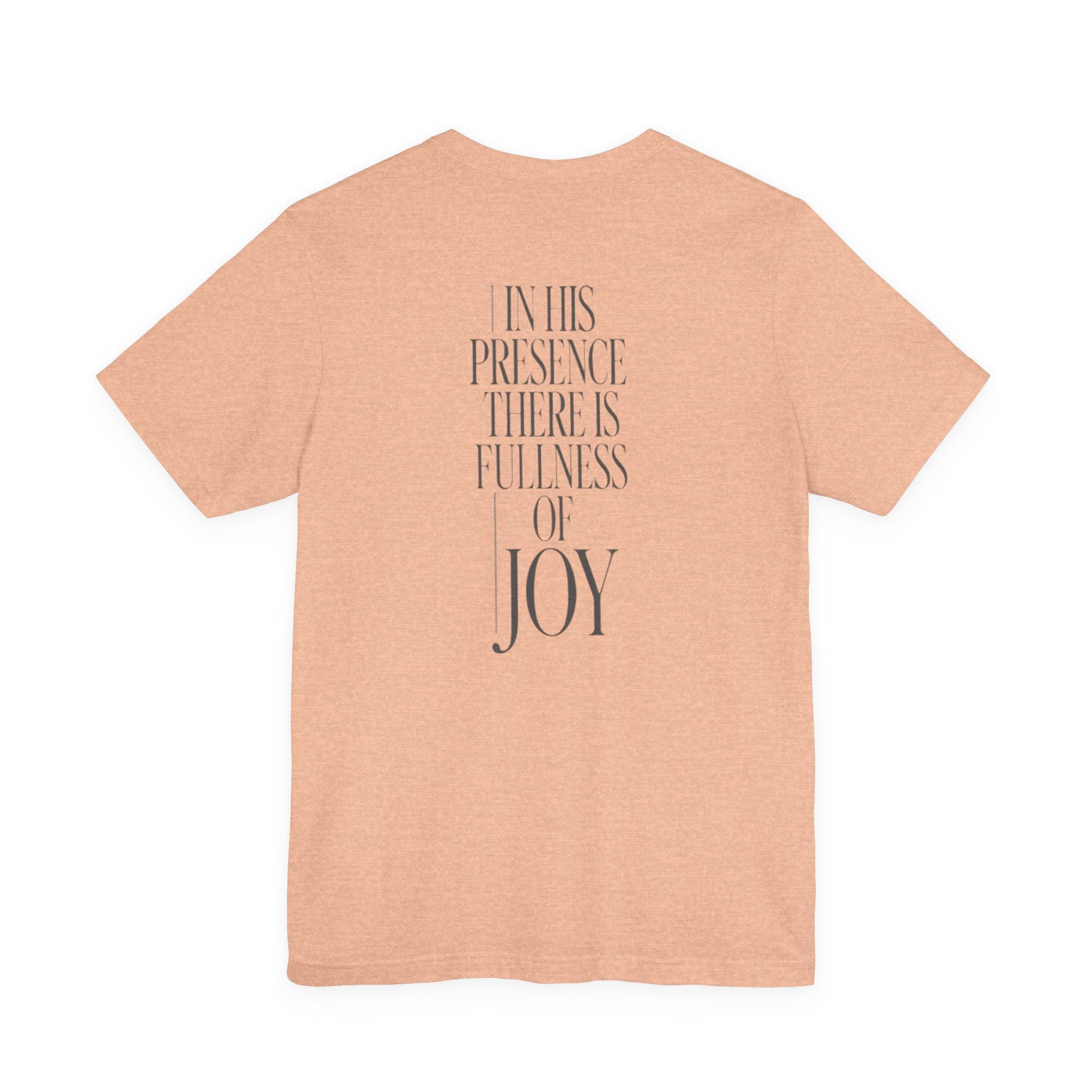 Peach t-shirt with motivational quote on the back against a white background