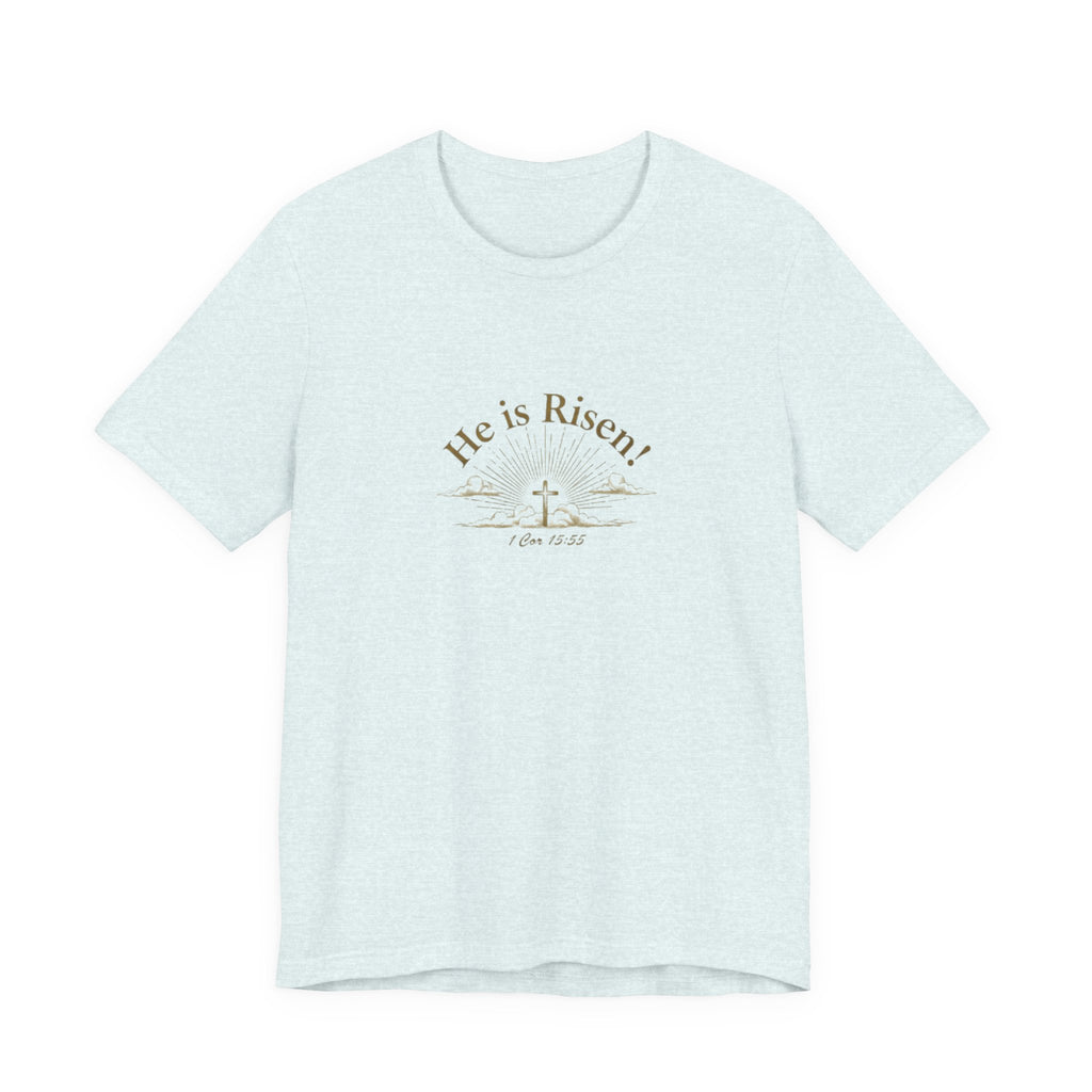 Light blue t-shirt with 'He is Risen!' text and cross design on a white background