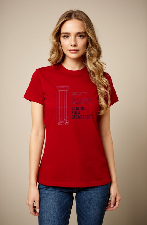 A woman modeling a red short-sleeve crewneck t-shirt with a dark red graphic print of the IFFIH Standard Art Gallery on the front, paired with blue jeans against a solid beige background.