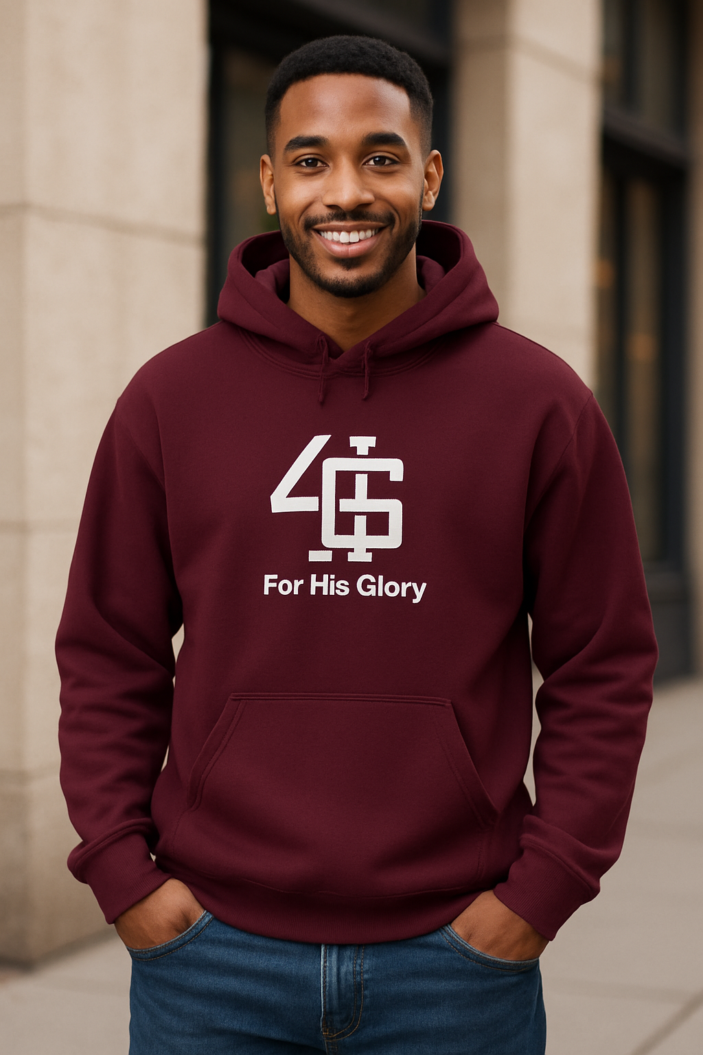 Man wearing a maroon hoodie with '4G For His Glory' logo standing outdoors.