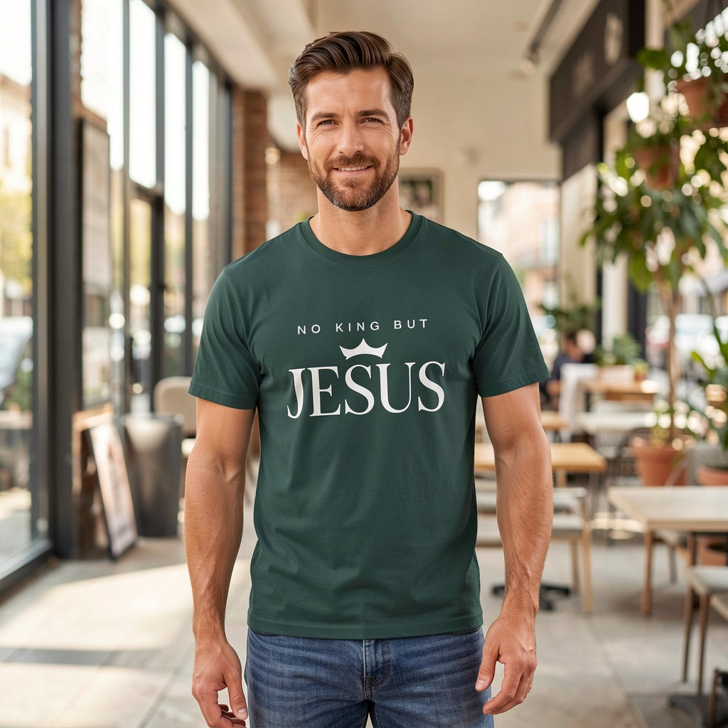 Man wearing a green t-shirt with 'No King But Jesus' text in an outdoor setting.
