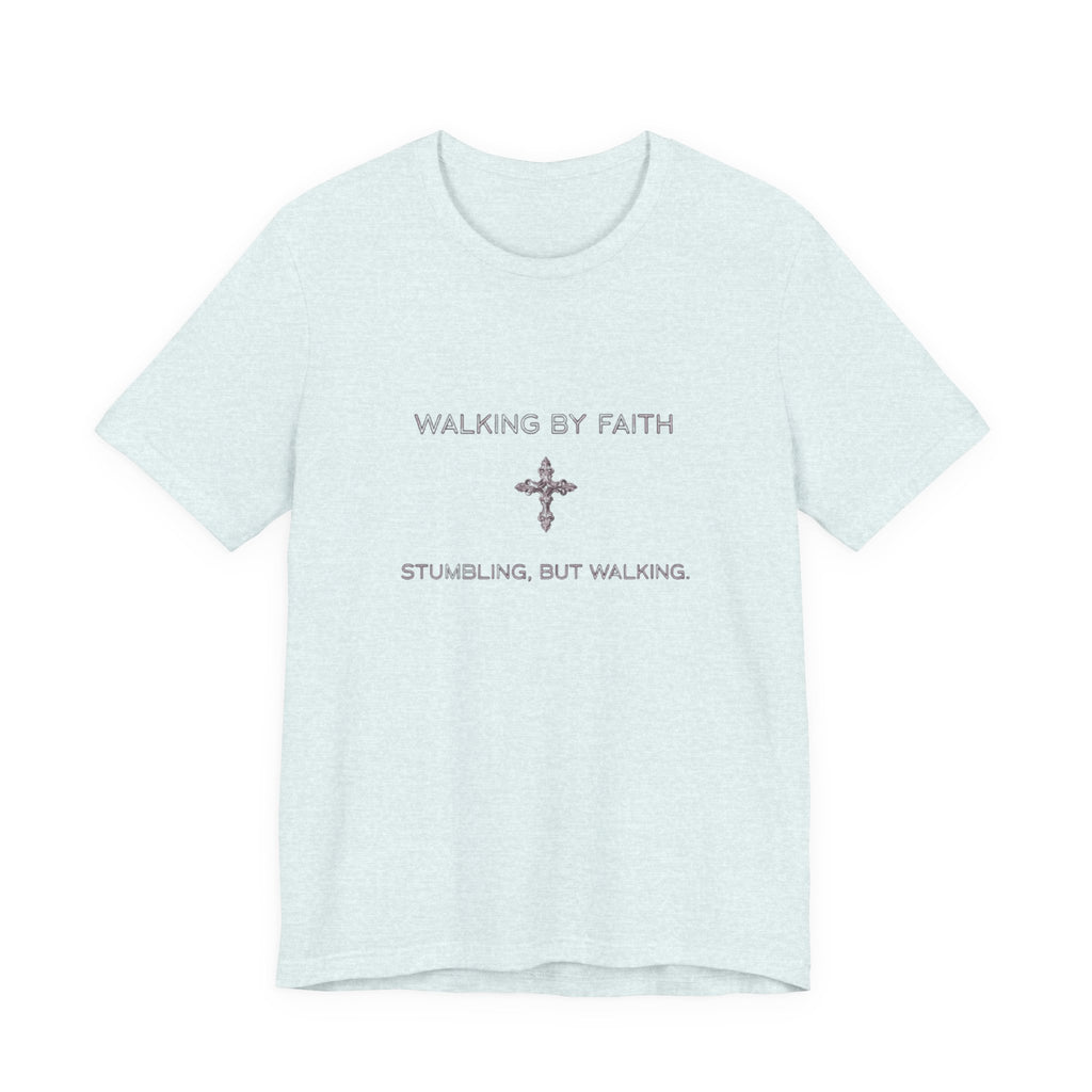Light blue t-shirt with text 'WALKING BY FAITH STUMBLING, BUT WALKING' on a white background
