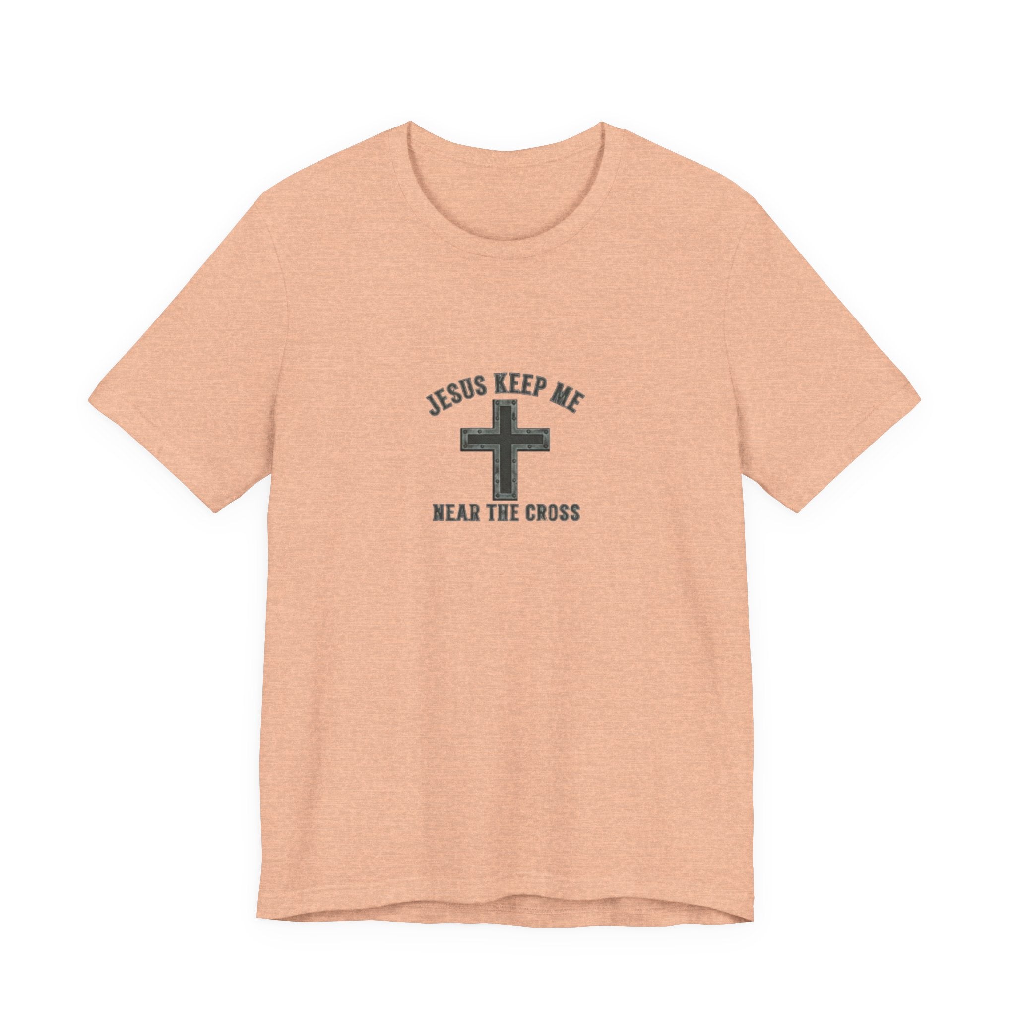Peach t-shirt with a cross design and text on a white background