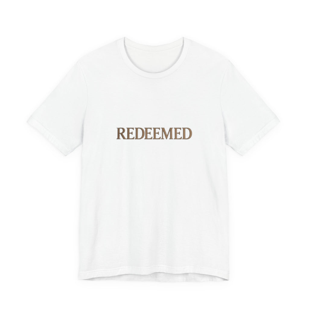 White t-shirt with 'REDEEMED' text in gold on a white background