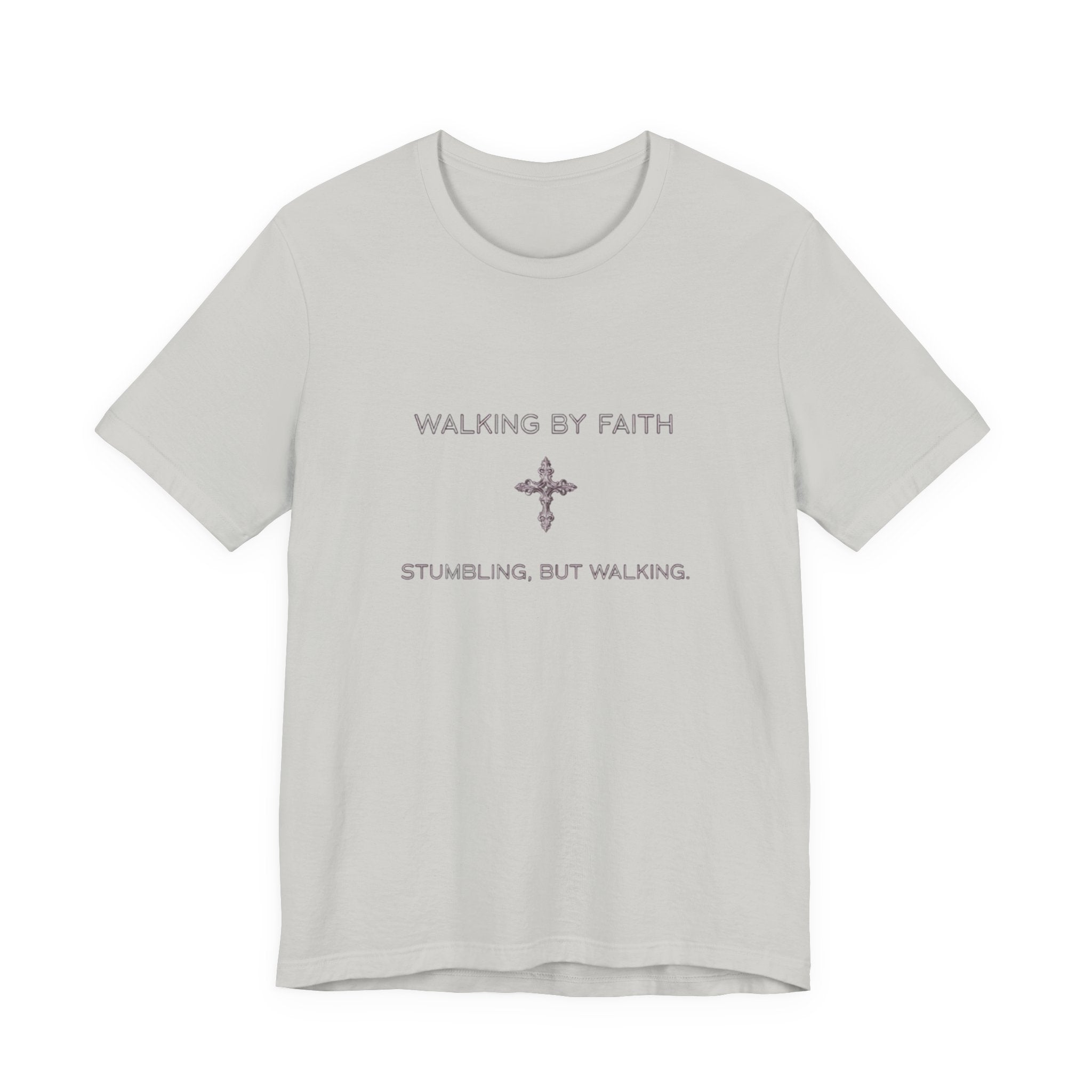 Light gray t-shirt with text 'WALKING BY FAITH' and 'STUMBLING, BUT WALKING.' on a white background