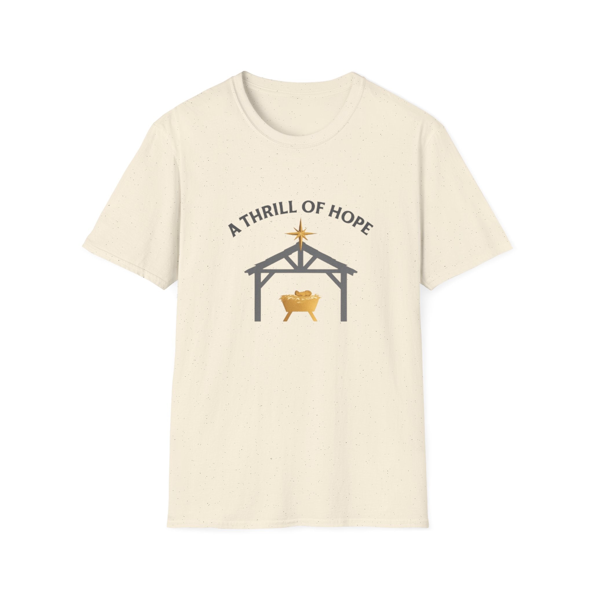 Beige t-shirt with nativity scene graphic and 'A Thrill of Hope' text on a white background