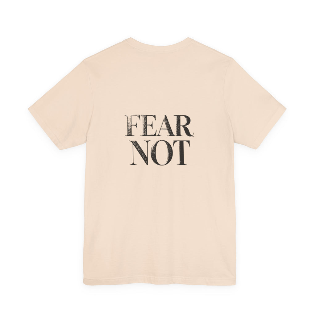 Beige t-shirt with 'FEAR NOT' text on a white background