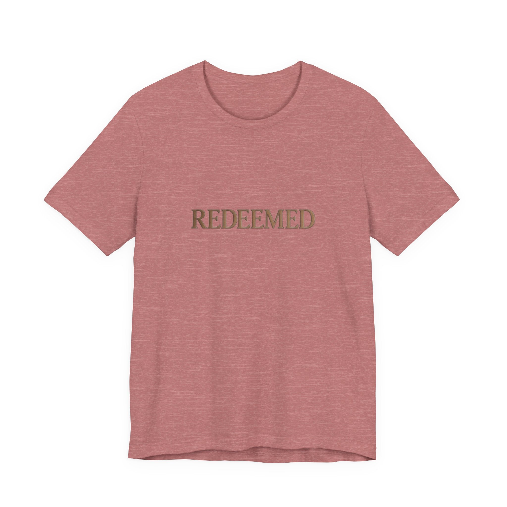 Pink t-shirt with 'REDEEMED' text on a white background