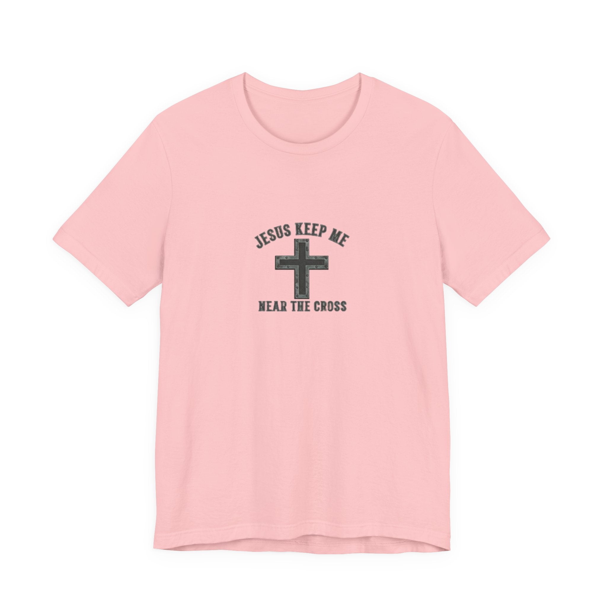 Pink t-shirt with a cross design and text on a white background