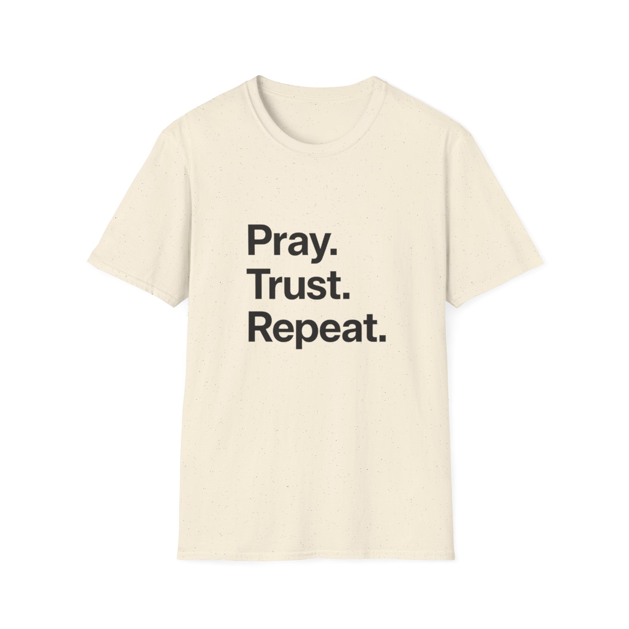 Beige t-shirt with 'Pray. Trust. Repeat.' text on a white background