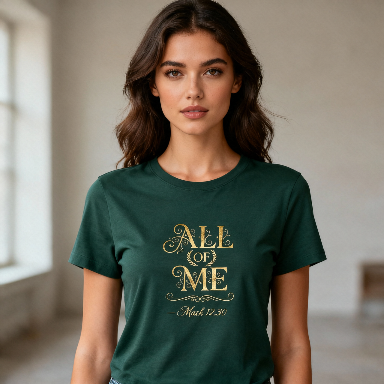 Woman wearing a green t-shirt with 'All of Me' text in gold.