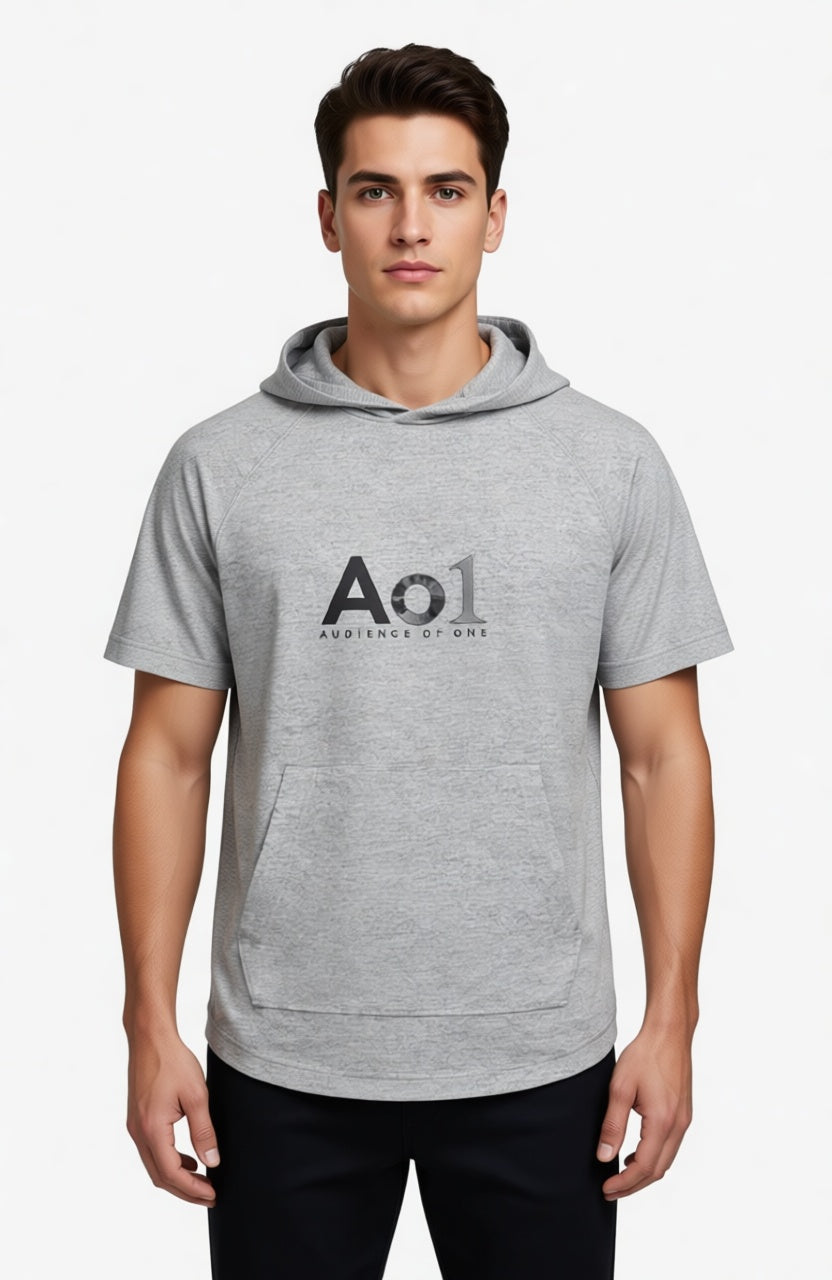 Male model wearing Audience of One Short Sleeve Hoodie in Light Grey Heather — editorial white background front view, Colossians 3:23 Audience of One design, performance faith-based hoodie by 4HG