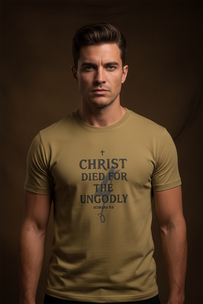 Male model wearing Christ Died for the Ungodly Tee in Faded Mustard — editorial style front view, Romans 5:8 scripture design, garment-dyed Christian tee by 4HG