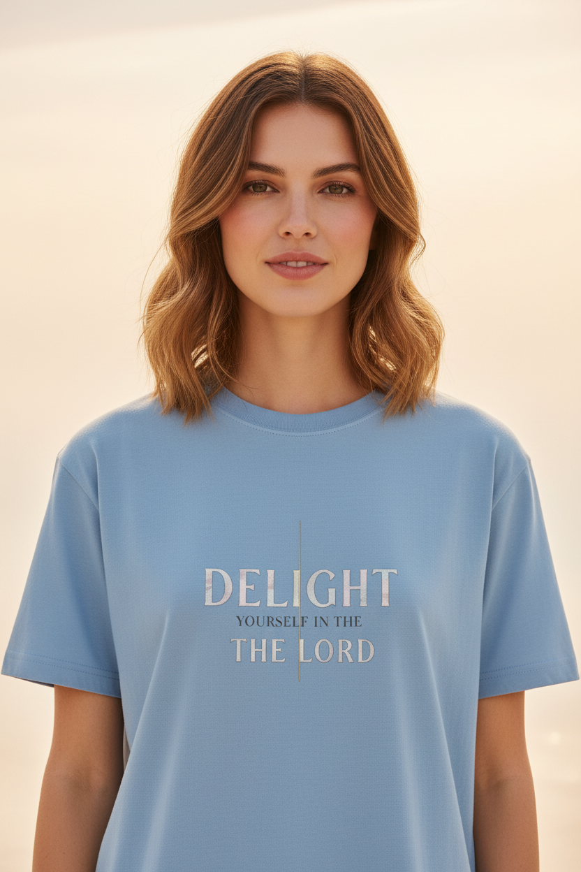 Female model wearing Delight Yourself In The Lord Supima Tee in Slate — front facing, editorial
