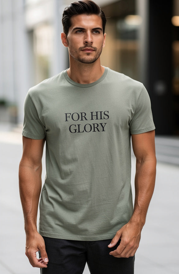 Man wearing a green t-shirt with 'FOR HIS GLORY' text on a blurred street background