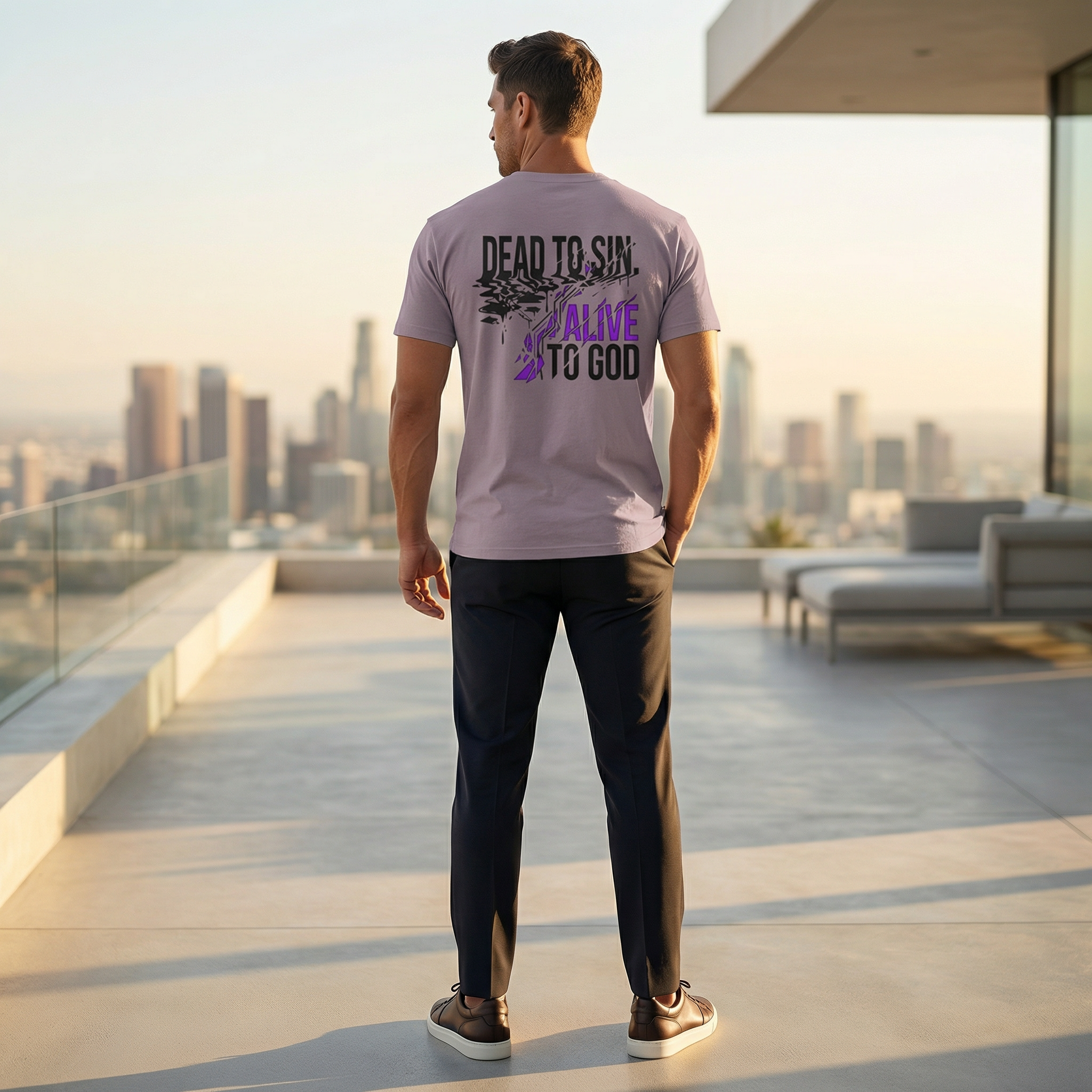 Male model wearing Dead to Sin Alive to God Super Heavyweight Tee in Smokey Violet — back view showing Romans 6:11 scripture design, oversized Christian tee by 4HG