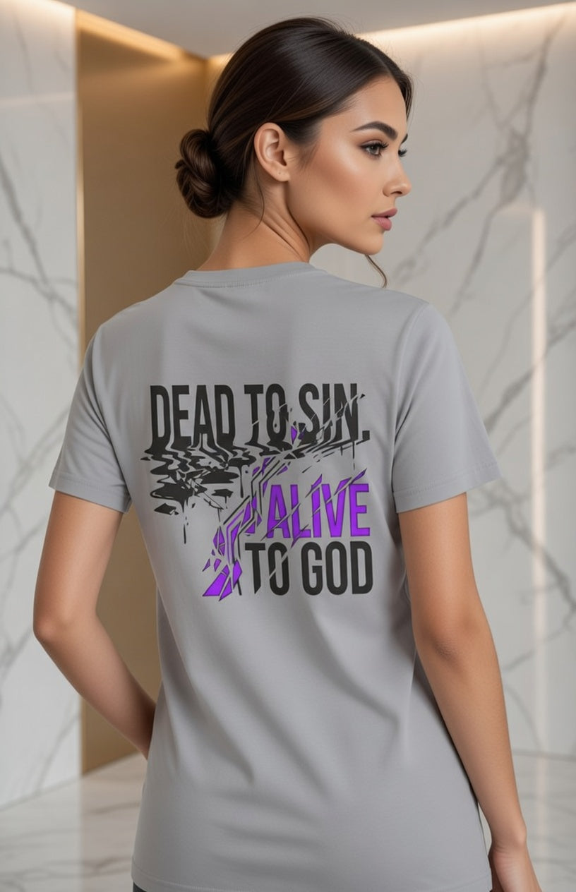 Female model wearing Dead to Sin Alive to God Super Heavyweight Tee in Gravel — back view showing Romans 6:11 scripture design, oversized Christian tee by 4HG