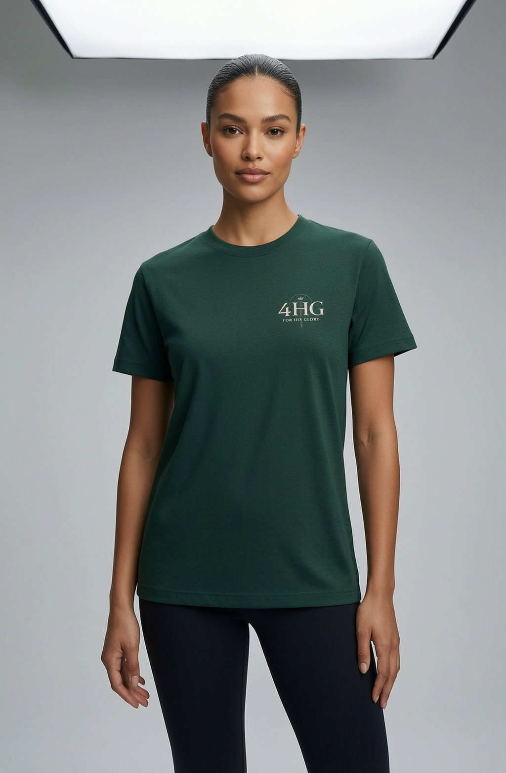 Editorial mockup with female model wearing forest green shirt with left chest logo.