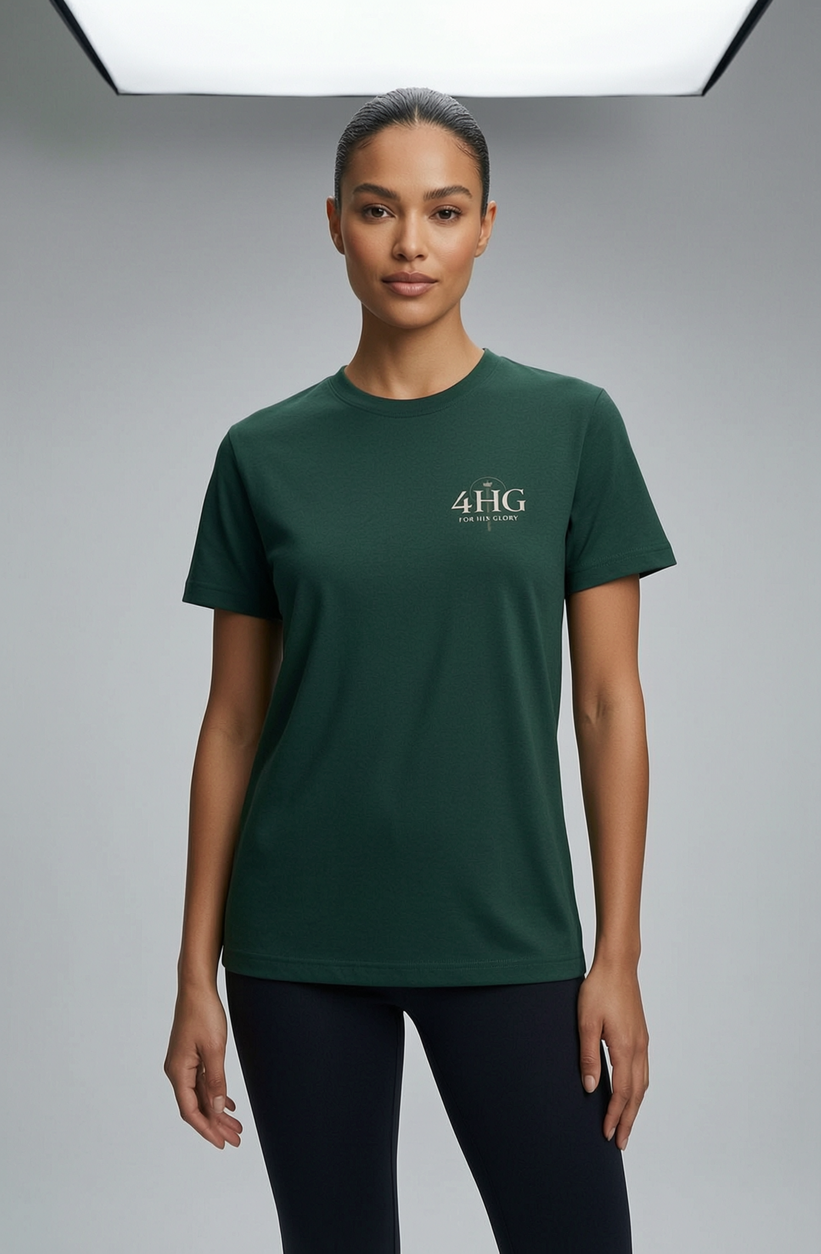 Editorial mockup with female model wearing forest green shirt with left chest logo.