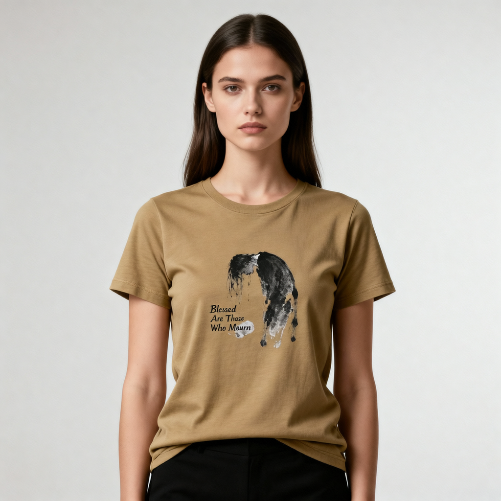 Woman wearing a brown t-shirt with a graphic design and text on a plain background