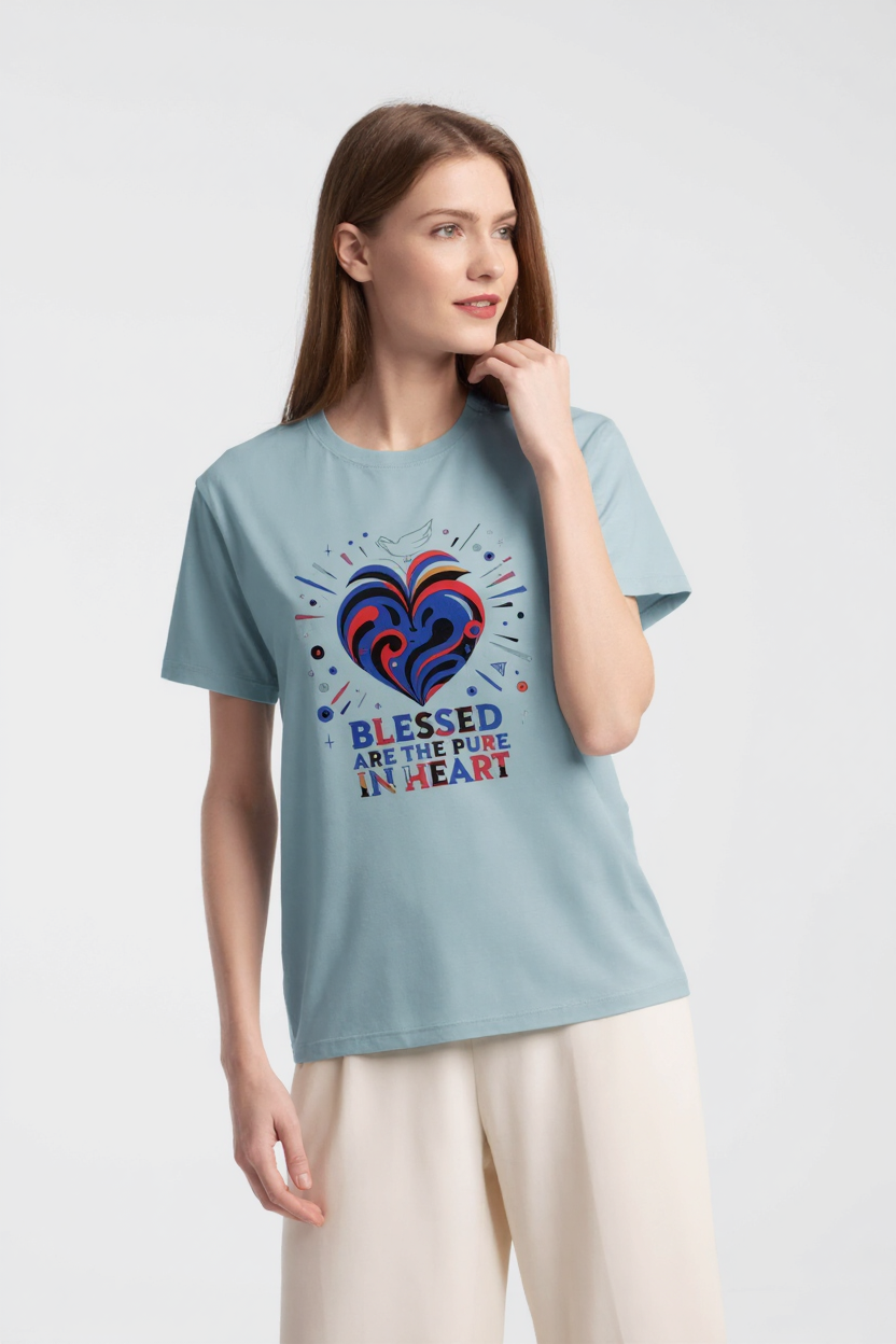 Woman wearing a light blue t-shirt with a colorful heart design and text on a white background