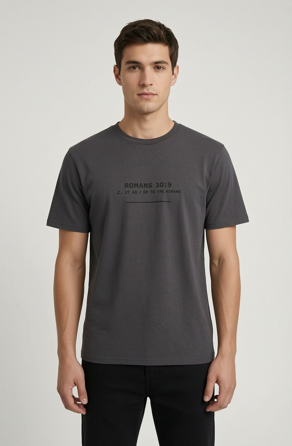 Man wearing a dark gray t-shirt with text on a light gray background