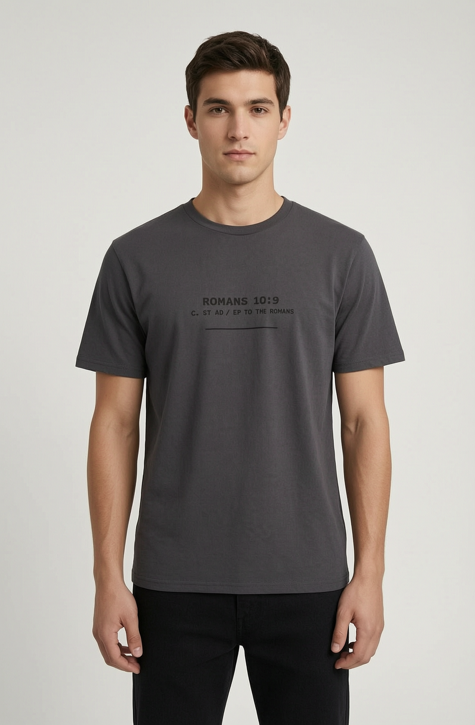Man wearing a dark gray t-shirt with text on a light gray background