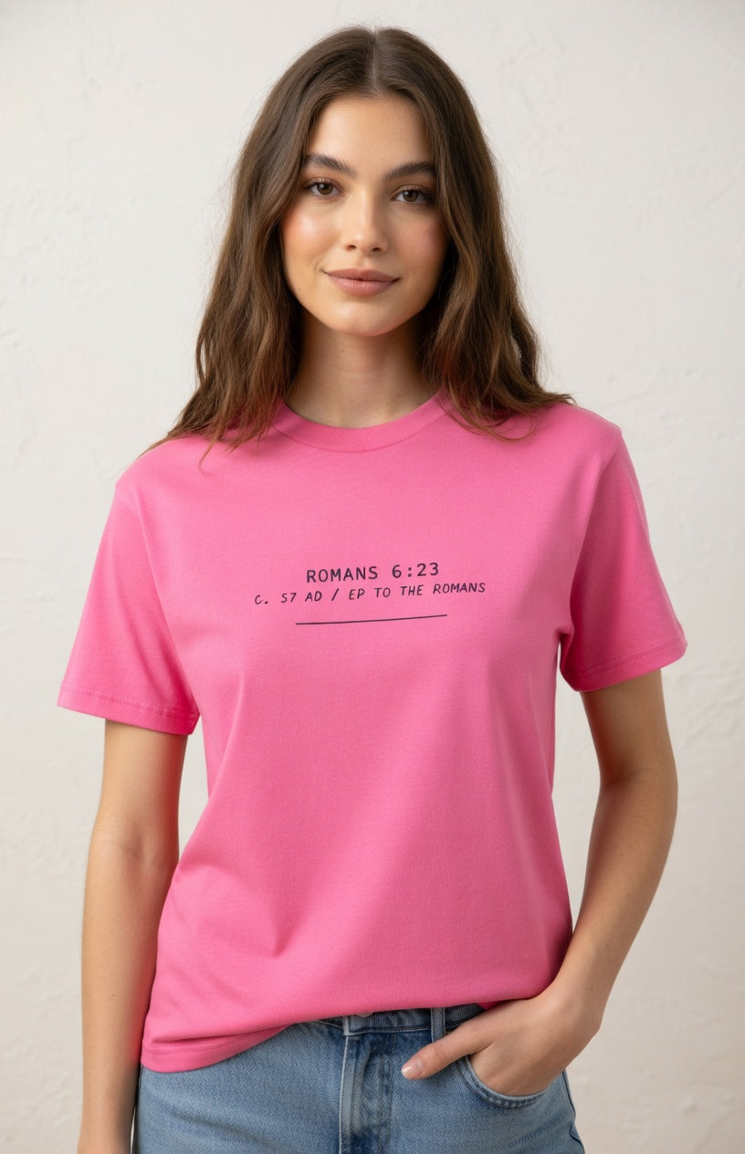 Person wearing a pink t-shirt with text on a plain background