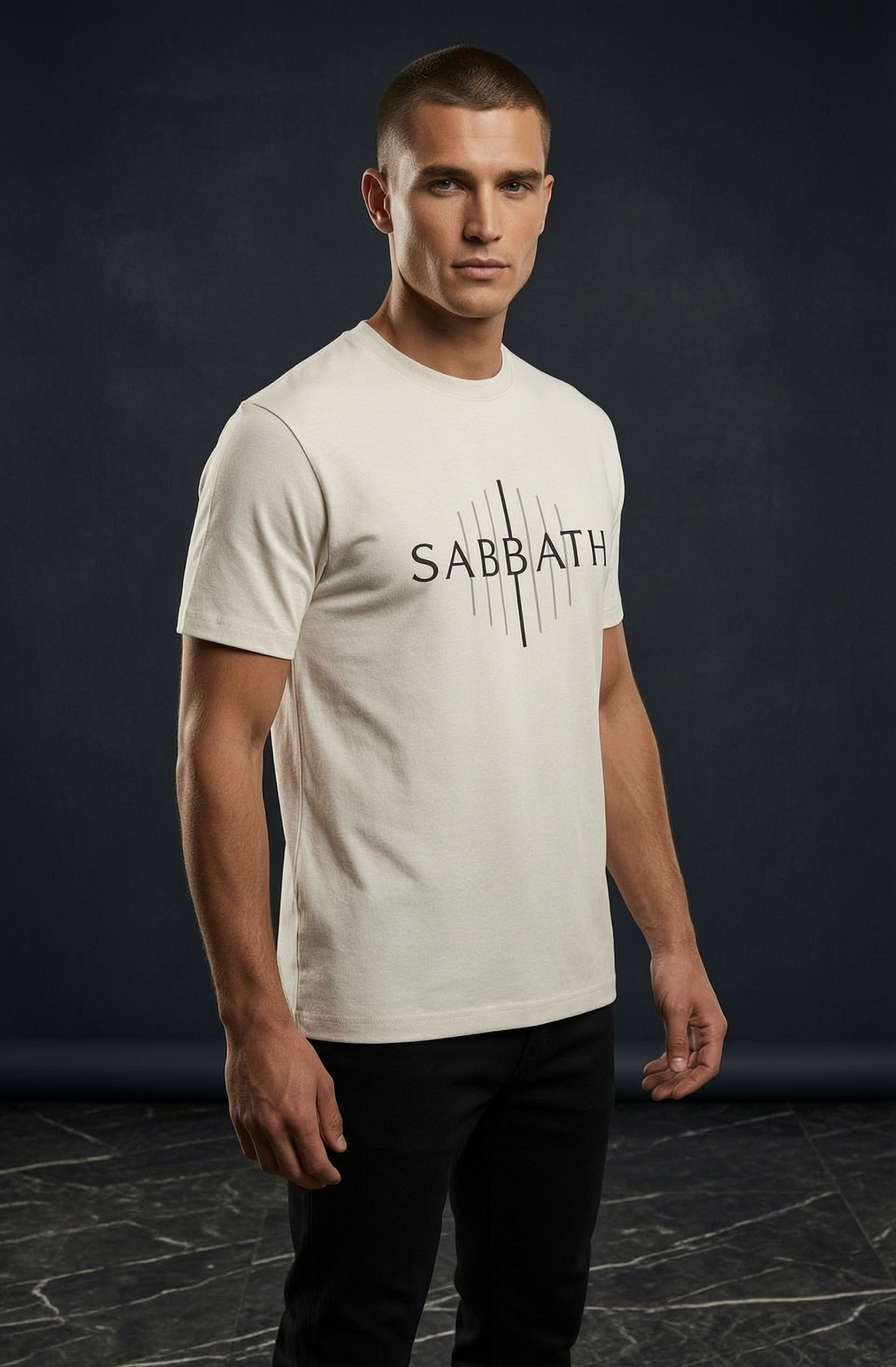 Man wearing a white t-shirt with 'SABBATH' printed on it against a dark background