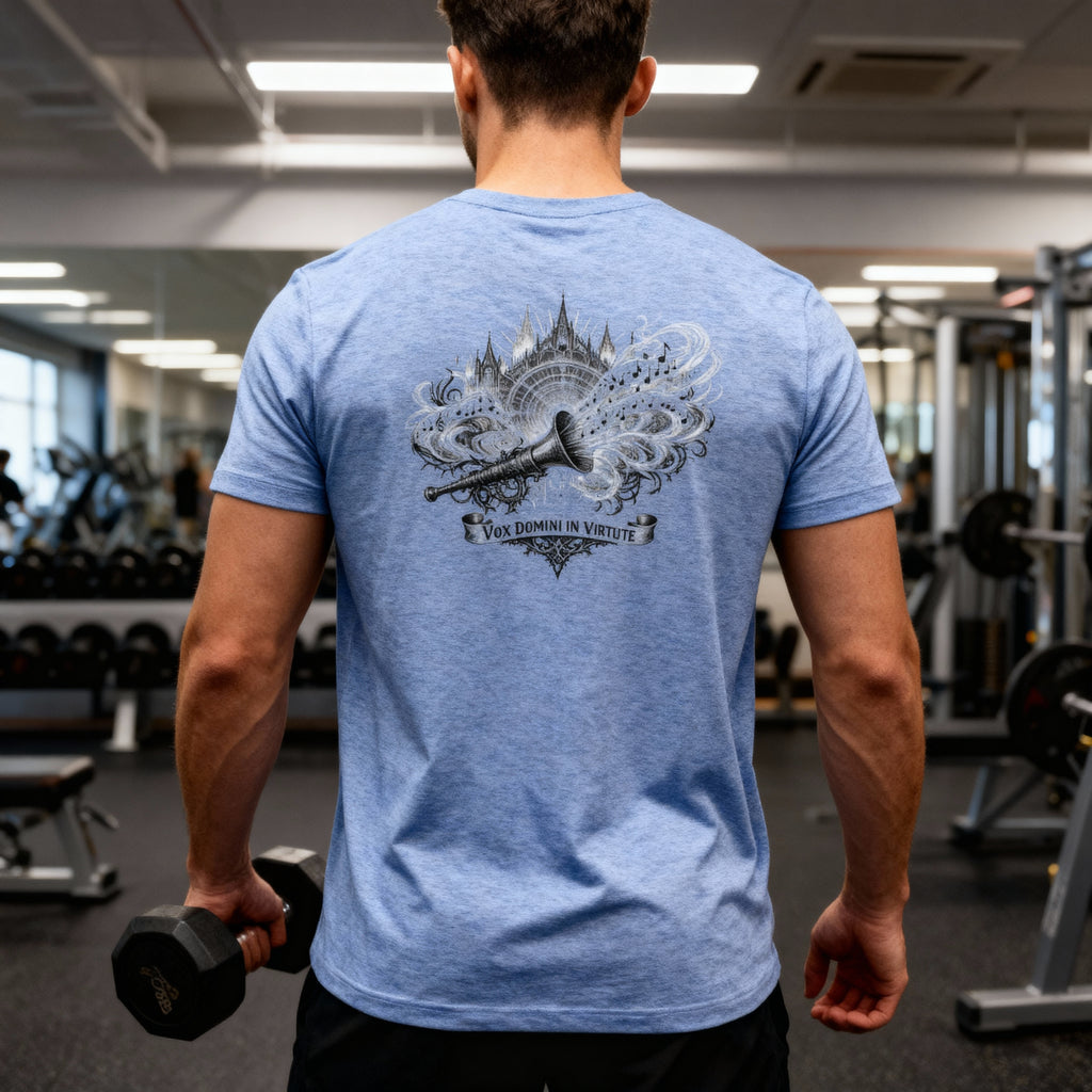 Man wearing a blue t-shirt with VOX DIVINI IN VIRTUTE on the back in a gym setting