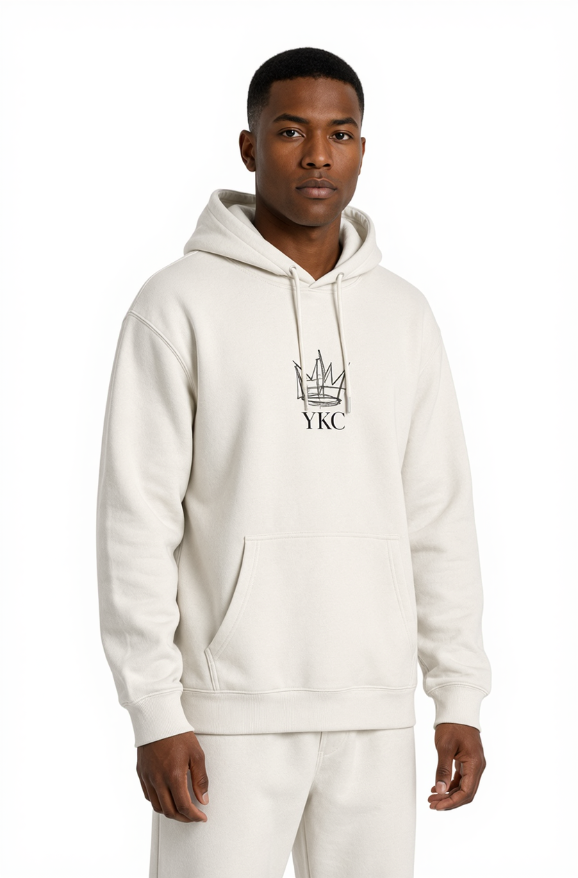 Man wearing a white hoodie with a logo on a white background